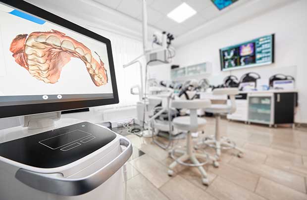 Modern medical classroom equipped with digital screens displaying human anatomy